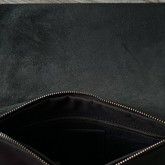 Able black leather clutch. NWT.